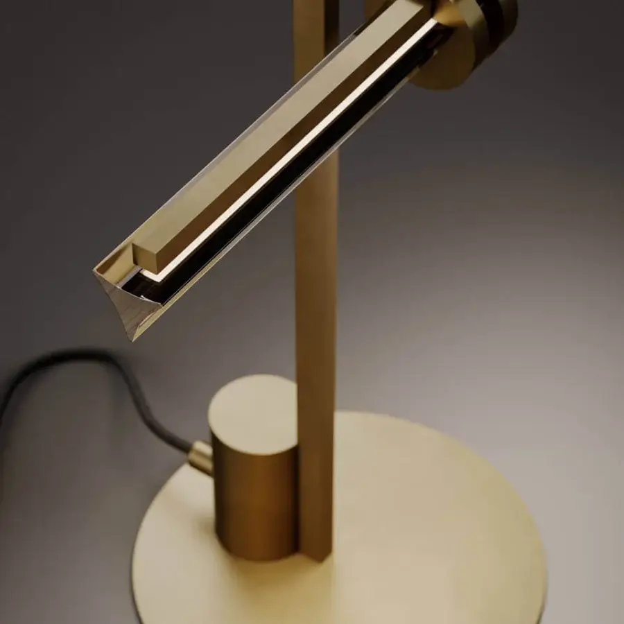 Distinguished VENICEM Optical table lamp with a smoke grey crystal triangular trihedron diffuser and natural burnished brass structure