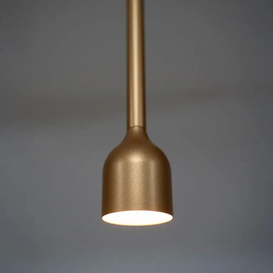 Superior Penta Hail suspension lamp crafted in metal with a warm golden satin finish and a curved silhouette