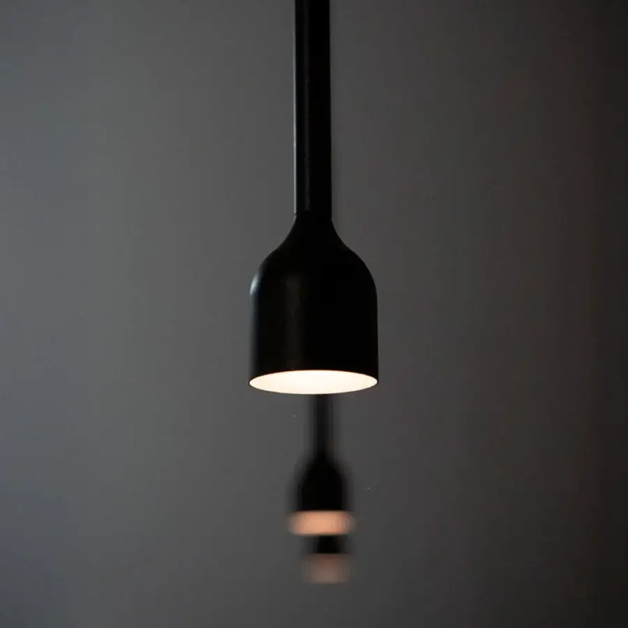 Elegant Penta Hail suspension lamp crafted in metal with a matte black finish and subtle curves