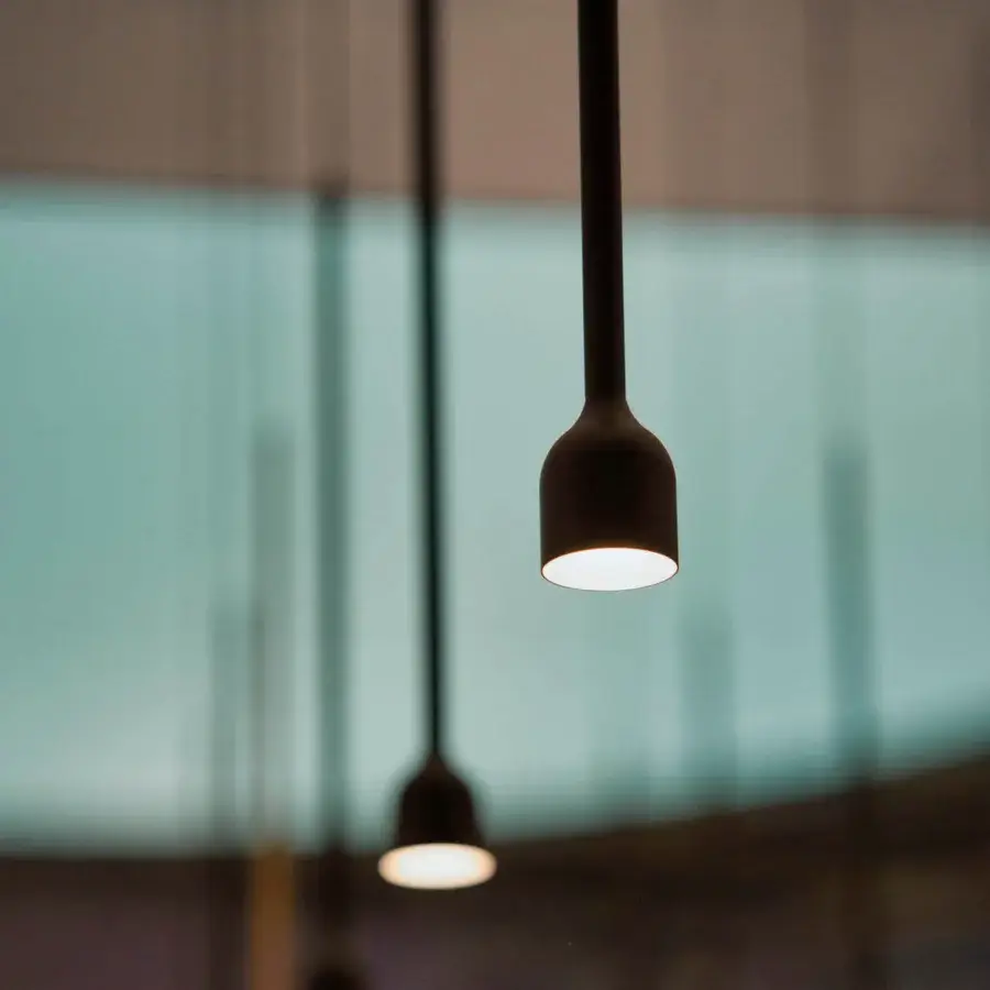 Superior Penta Hail suspension lamp crafted in metal with a matte muted gray finish and balanced cylindrical form
