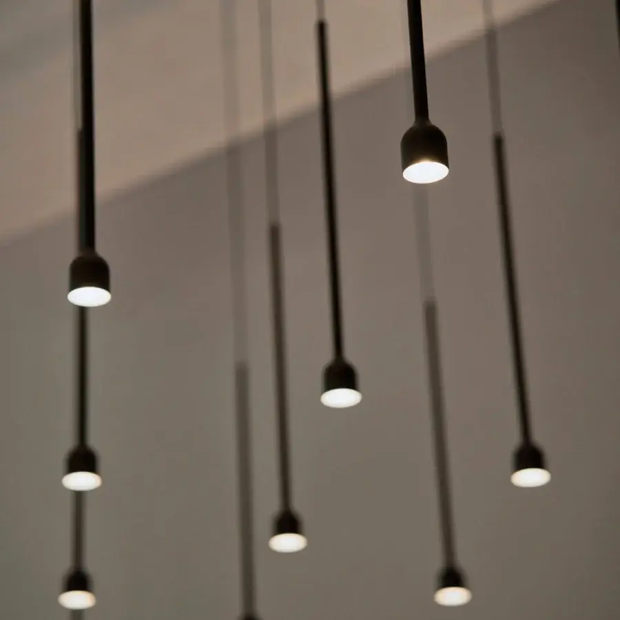 Elegant Penta Hail suspension lamp crafted in metal with a smooth matte black finish