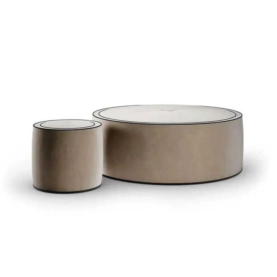 Refined Reflex Aura ottoman with neutral beige fabric upholstery and detailed crossed stitching