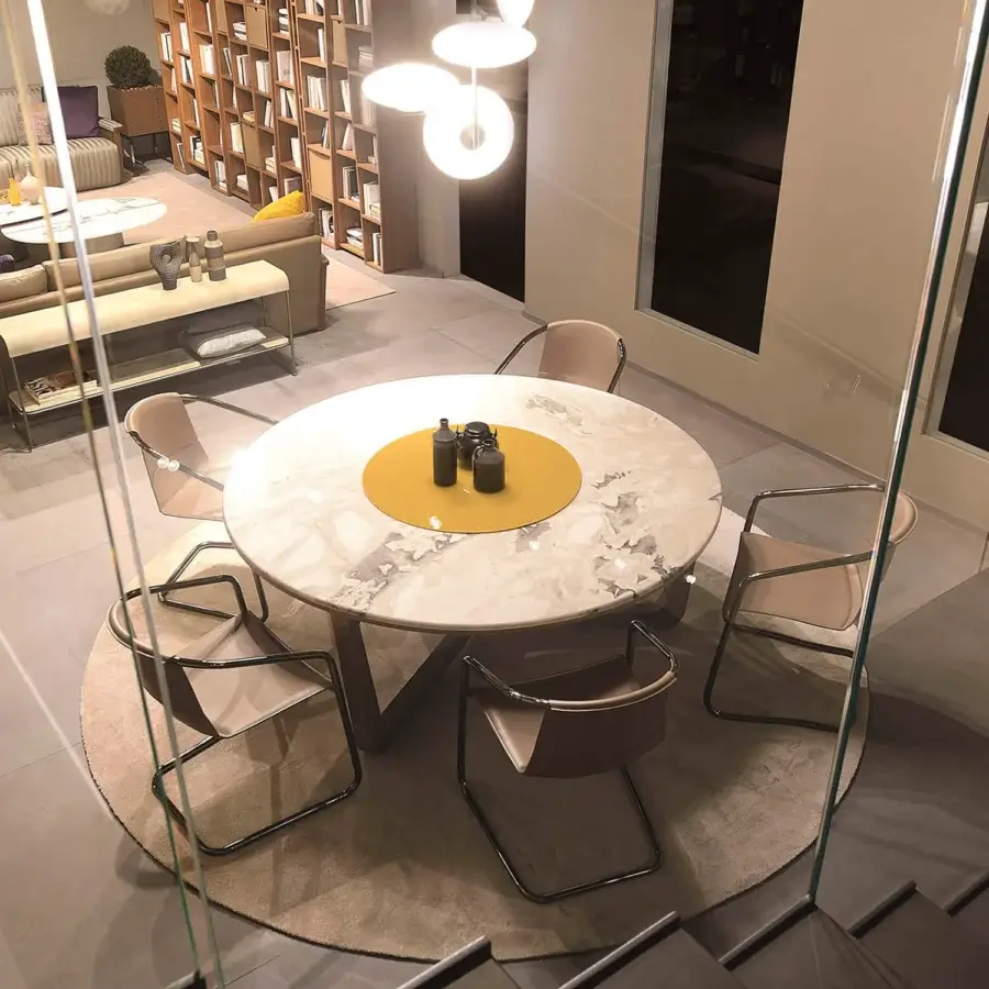 Elegant 4 Mariani Ascot table with light grey marble top and mustard-yellow painted glass in saddle leather base