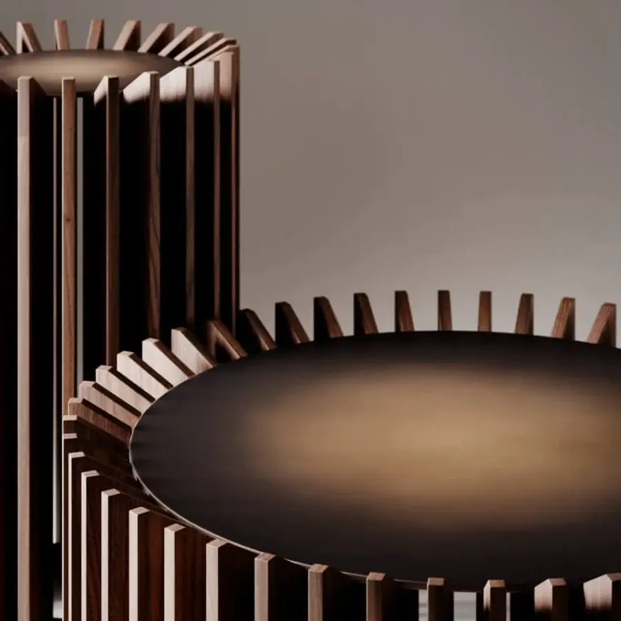 Innovative VENICEM Blade coffee table with black metal structure and refined matt canaletto walnut blades in burnished brass finish