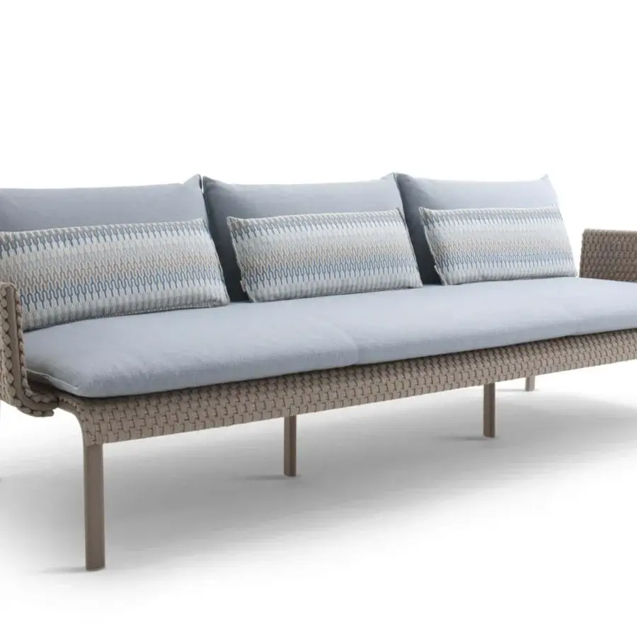 Sophisticated Roberti Rattan Key West sofa with durable Sunrope and Cipria powder-coated aluminum frame, contrasted by plush light blue cushions