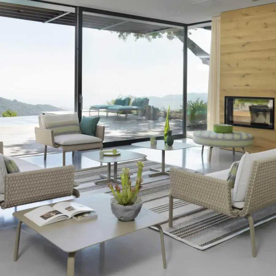 Lavish Roberti Rattan Key West sofa crafted with durable Sunrope in a calming light beige and Cipria powder-coated aluminum finish