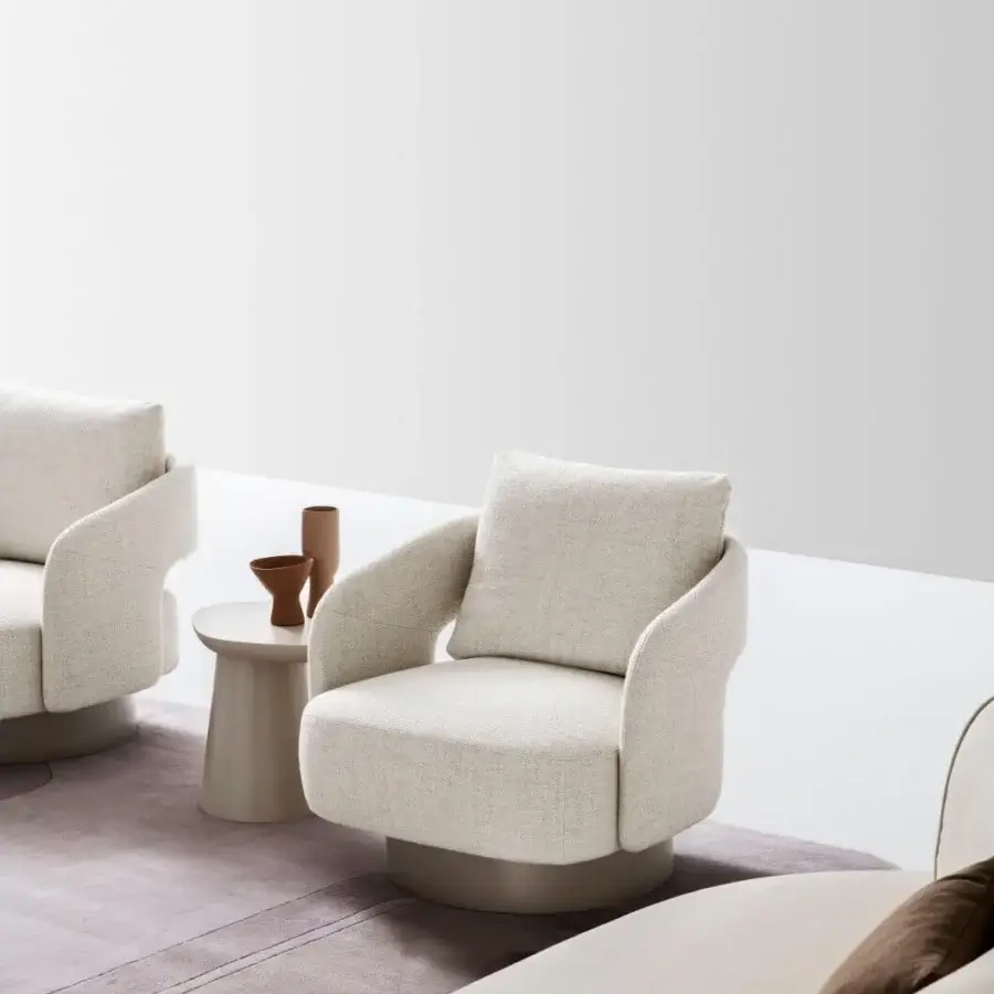 Distinguished Ditre Italia 356 lounge chair with enveloping form upholstered in textured light beige fabric and satin metal base