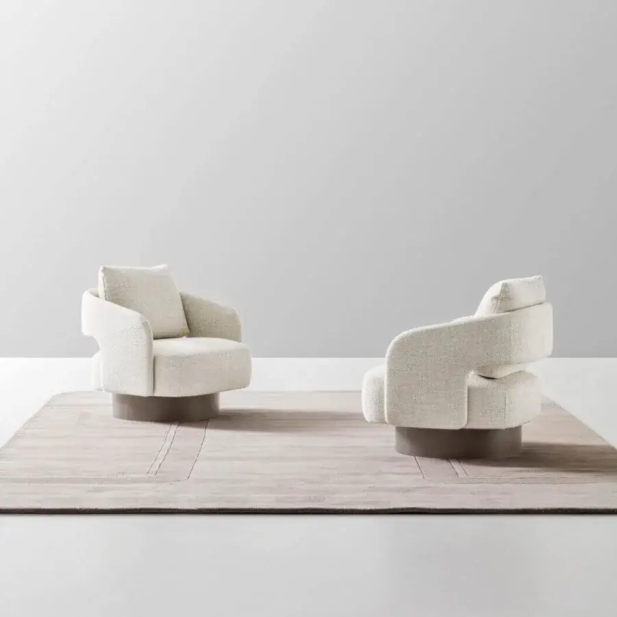 Elegant Ditre Italia 356 lounge chair with rounded silhouette upholstered in light neutral beige fabric and sleek varnished metal base
