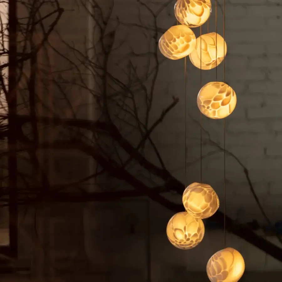 Captivating Bocci 118 Random Suspension Lamp with hand-blown glass pendants and a textured amber surface