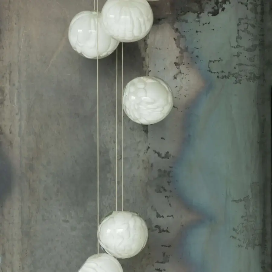 Distinguished Bocci 118 Random Suspension Lamp with eleven textured glass pendants and slender light-colored cords in a matte finish