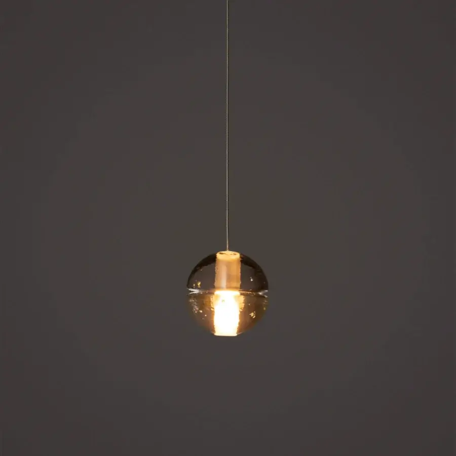 Superior Bocci 14 Single Pendant suspension lamp with amber cast glass and frosted cylindrical void built with a dark neutral cable
