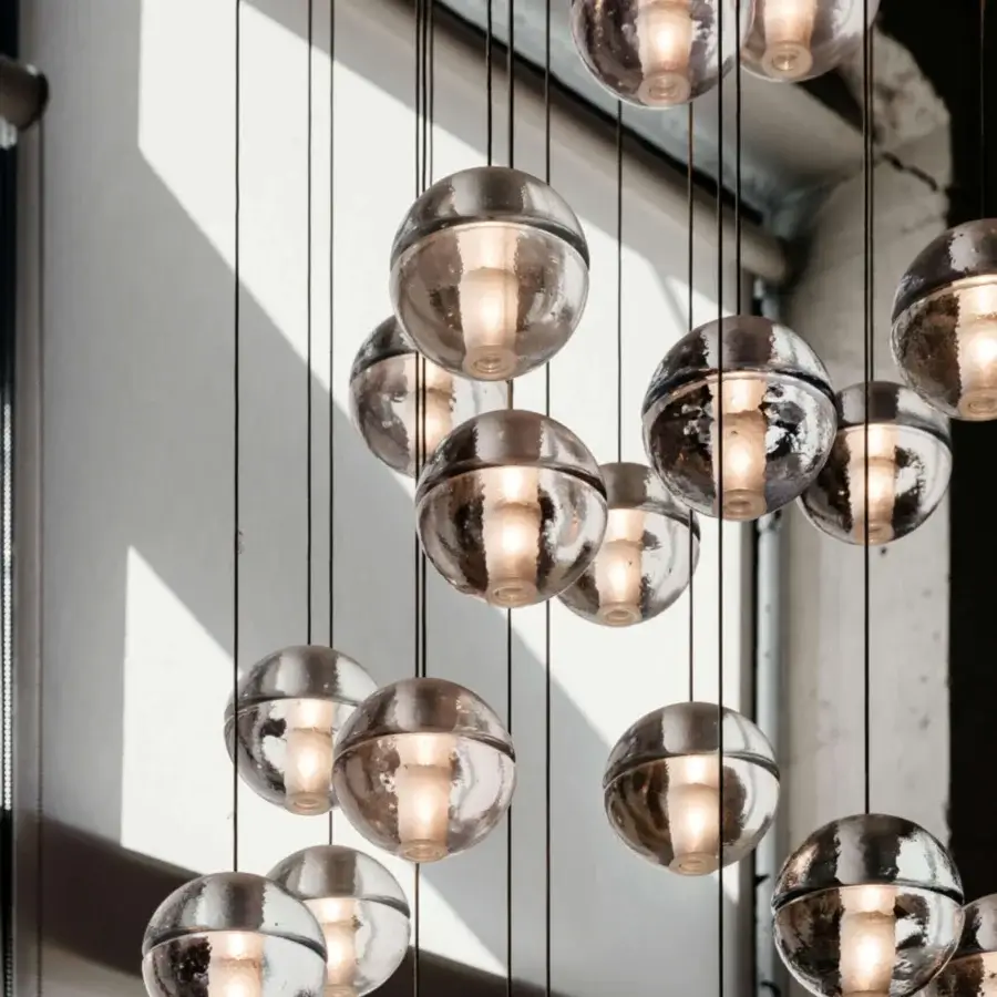 Exceptional Bocci 14 Random Suspension lamp with cast glass sphere and frosted cylindrical void in silver-toned mirrored finish