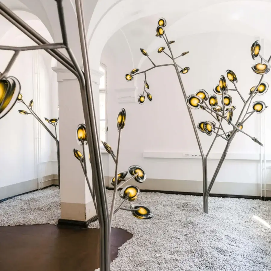 Superior Bocci 16 Tree floor lamp with amber glass shades and polished metal stem casts a warm glow