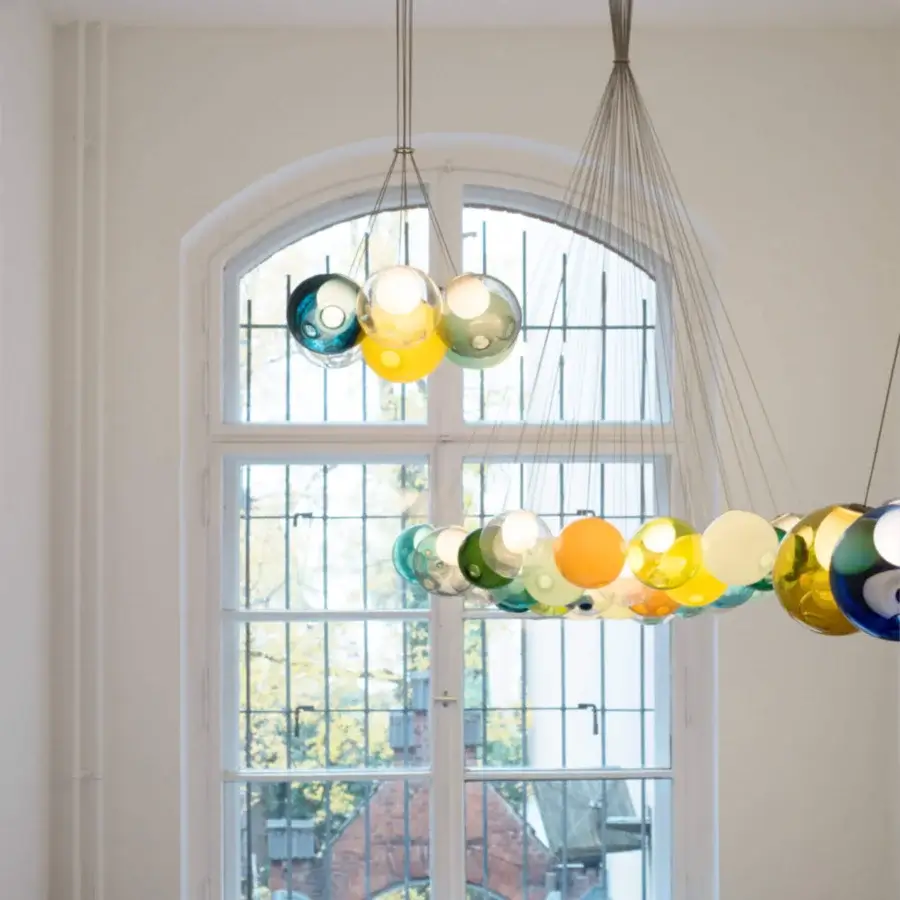 Exclusive Bocci 28 Cluster suspension lamp with a hexagonal bouquet of translucent hand-blown glass in yellow, green, blue and orange with polished metal support