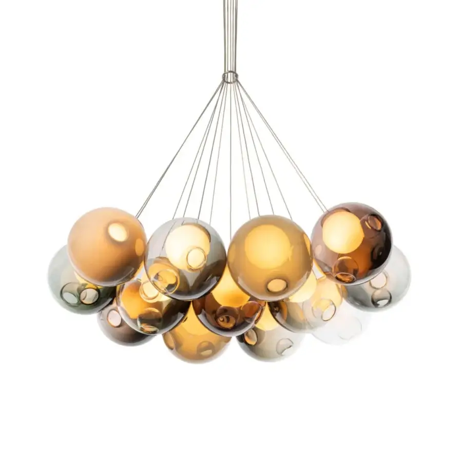 Distinguished Bocci 28 Cluster suspension lamp with clear glass exterior and milk white interior lamp holder cavities showcasing warm amber and bronze tones throughout a glossy form