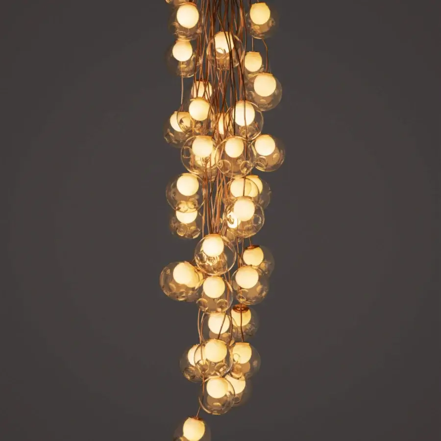 Distinguished Bocci 28 Copper suspension lamp crafted in clear glass with a natural copper framework and developing patina