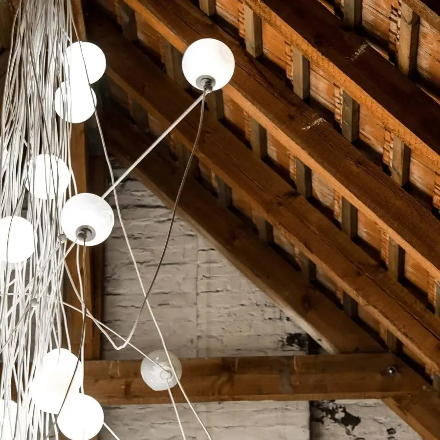 Exceptional Bocci 28 Copper suspension lamp crafted with clear glass spheres and milk white lamp holder cavities in natural copper with a developing patina
