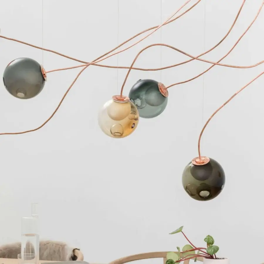 Elegant Bocci 28 Copper suspension lamp with clear glass spheres and milk white interior lamp holder cavities in natural copper