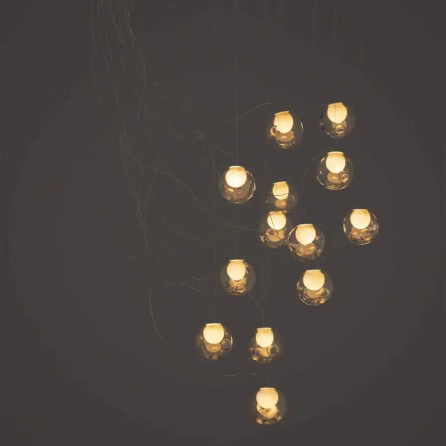 Elegant Bocci 28 sculptural lamp with cascading clear glass spheres and milk white interior cavities suspended by dark wires