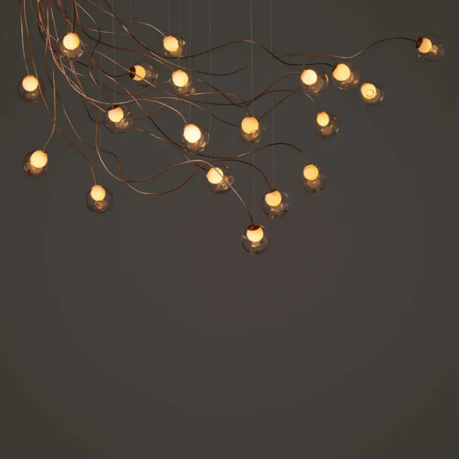 Elegant Bocci 28 sculptural cable lamp with branching form and clear glass spheres in warm-toned metal alloy with satin finish