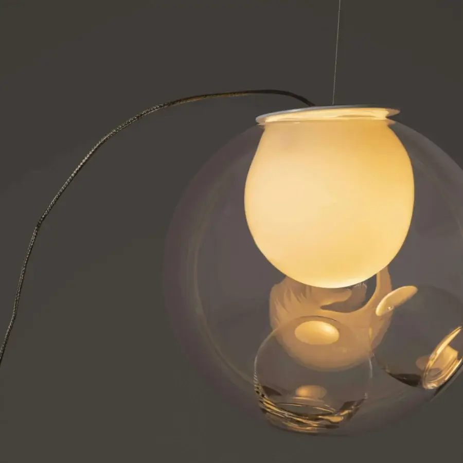 Superior Bocci 28 single sculptural lamp with a clear glass exterior and milk white interior, exhibiting a glossy finish