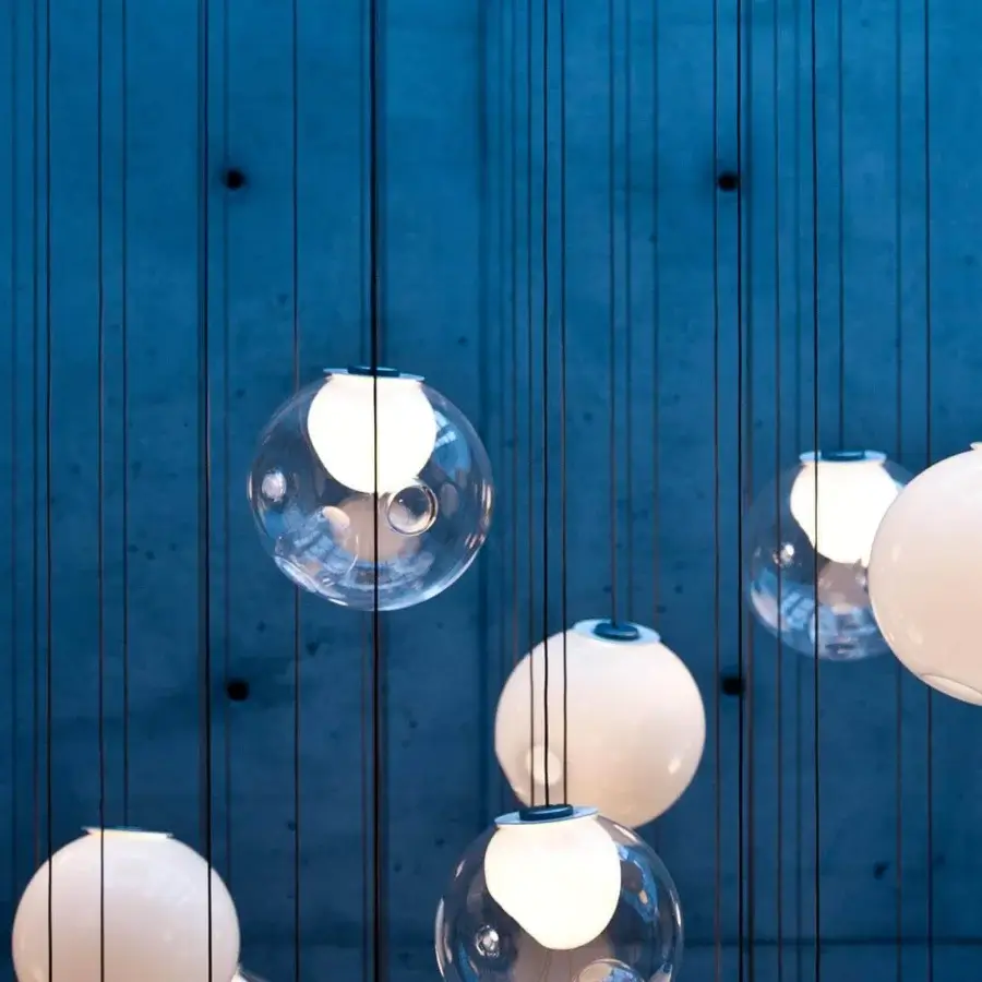 Exceptional Bocci 28 suspension lamp crafted in clear glass with a milk white interior and refined spherical form