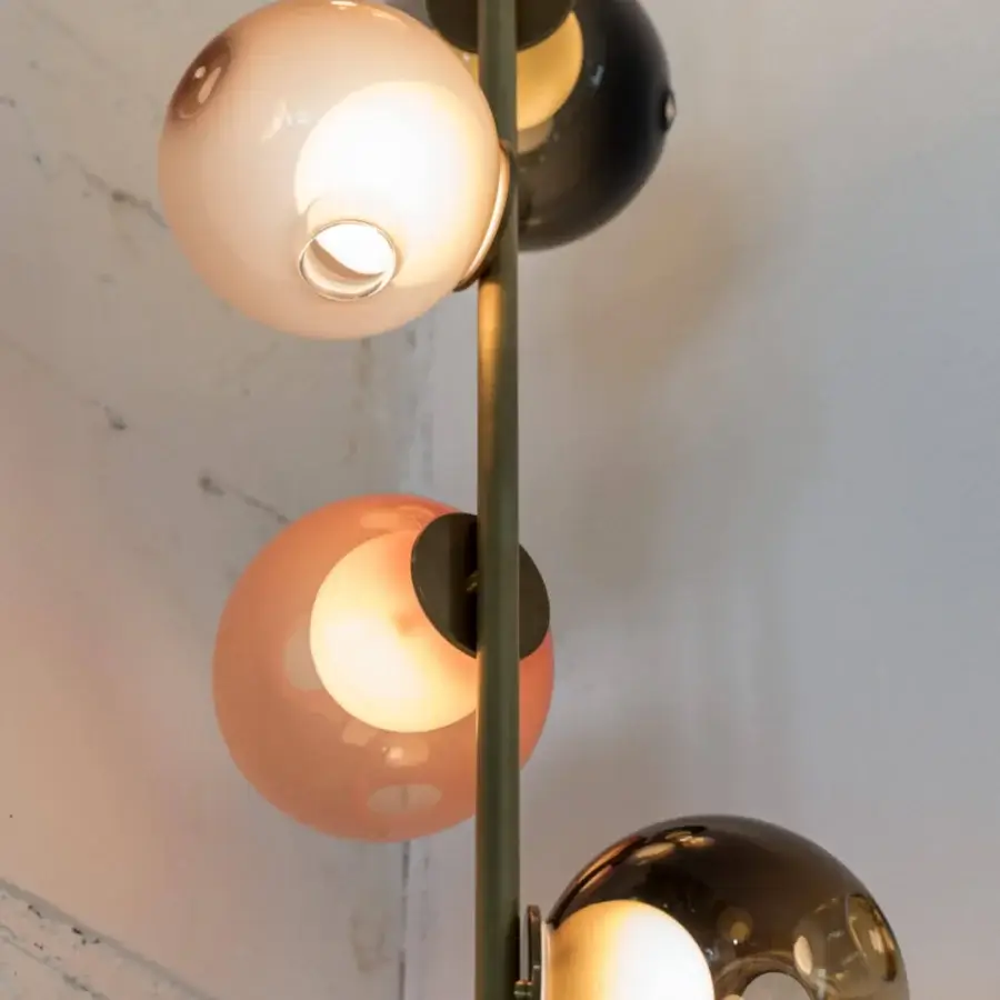 Exceptional Bocci 28 Stem Ceiling Lamp with a black metal structure supporting five hand-blown glass spheres in translucent white, gray and peach hues