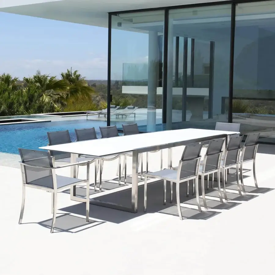 Elegant Royal Botania Ninix extendable table with reflective white tabletop and robust silver metal base boasts a glossy finish