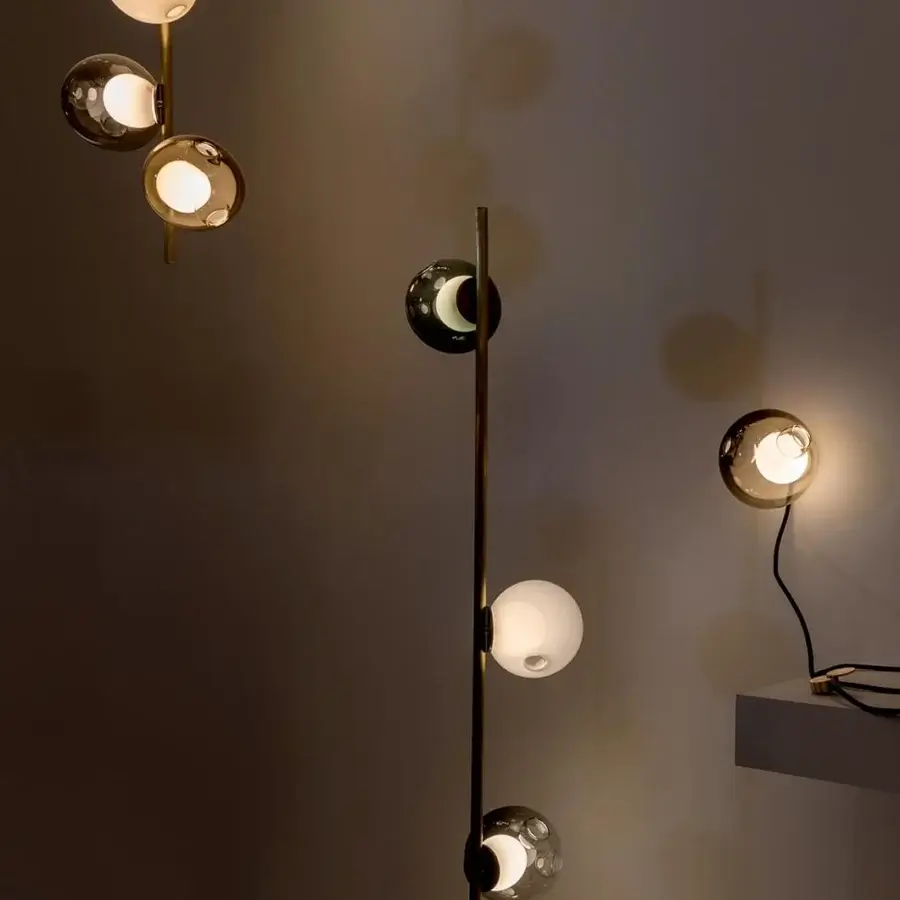 Distinguished Bocci 28 Stem Floor Lamp with a tall brass stem supporting uniquely distorted clear and milk white glass spheres crafted with complex techniques