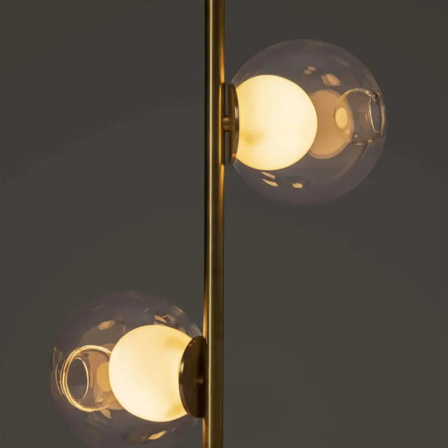Distinguished Bocci 28 Stem Floor Lamp with a slender brass stem and captivating clear glass spheres housing milk white lamp holders