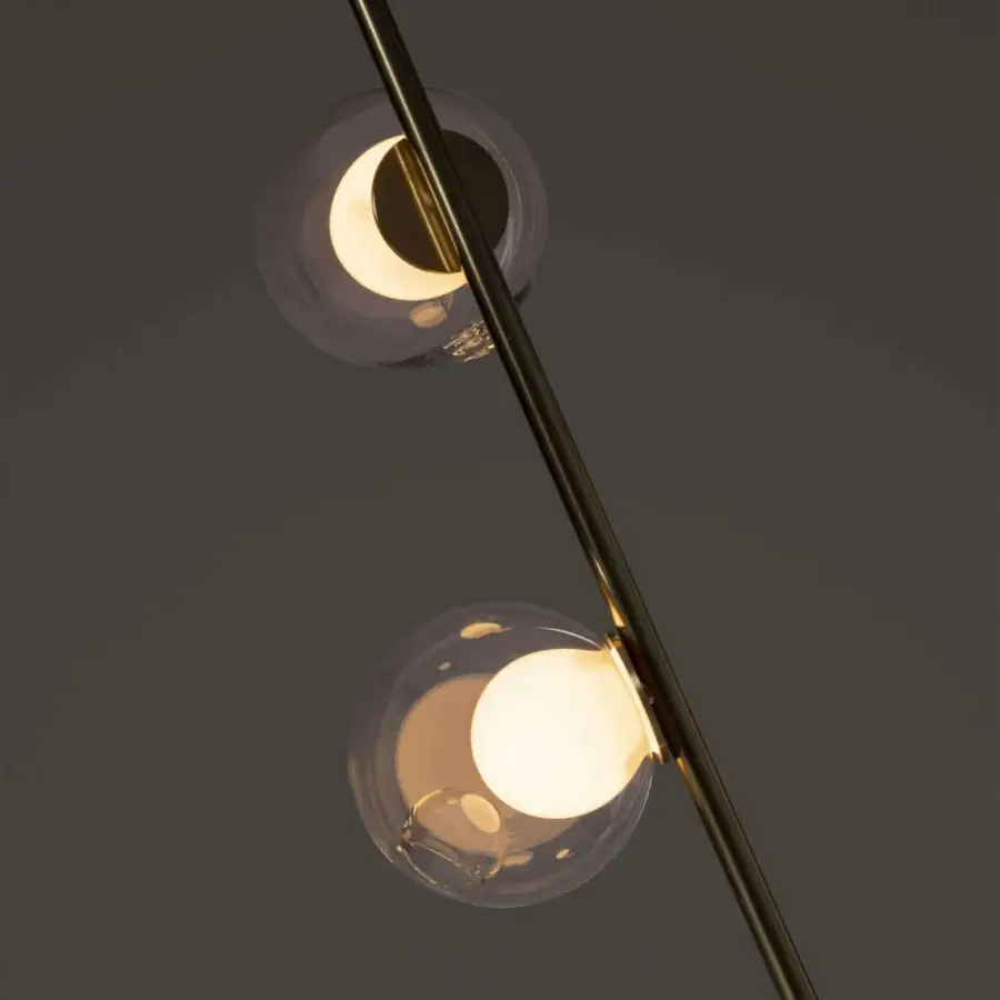 Luxury Bocci 28 Stem Floor to Ceiling Lamp with diagonally oriented form and clear glass exterior spheres crafted in refined brass finish