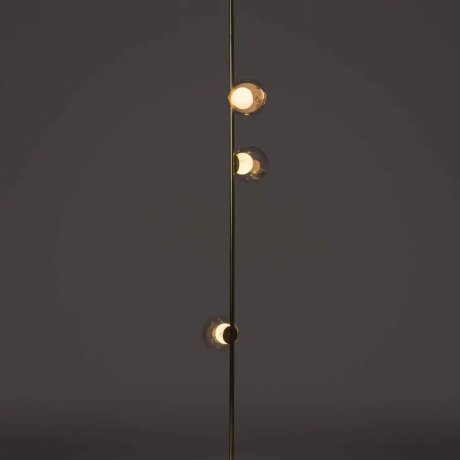 Luxury Bocci 28 Stem Floor to Ceiling Lamp crafted in brass with clear glass exterior spheres and milk white interior lamp holder cavities