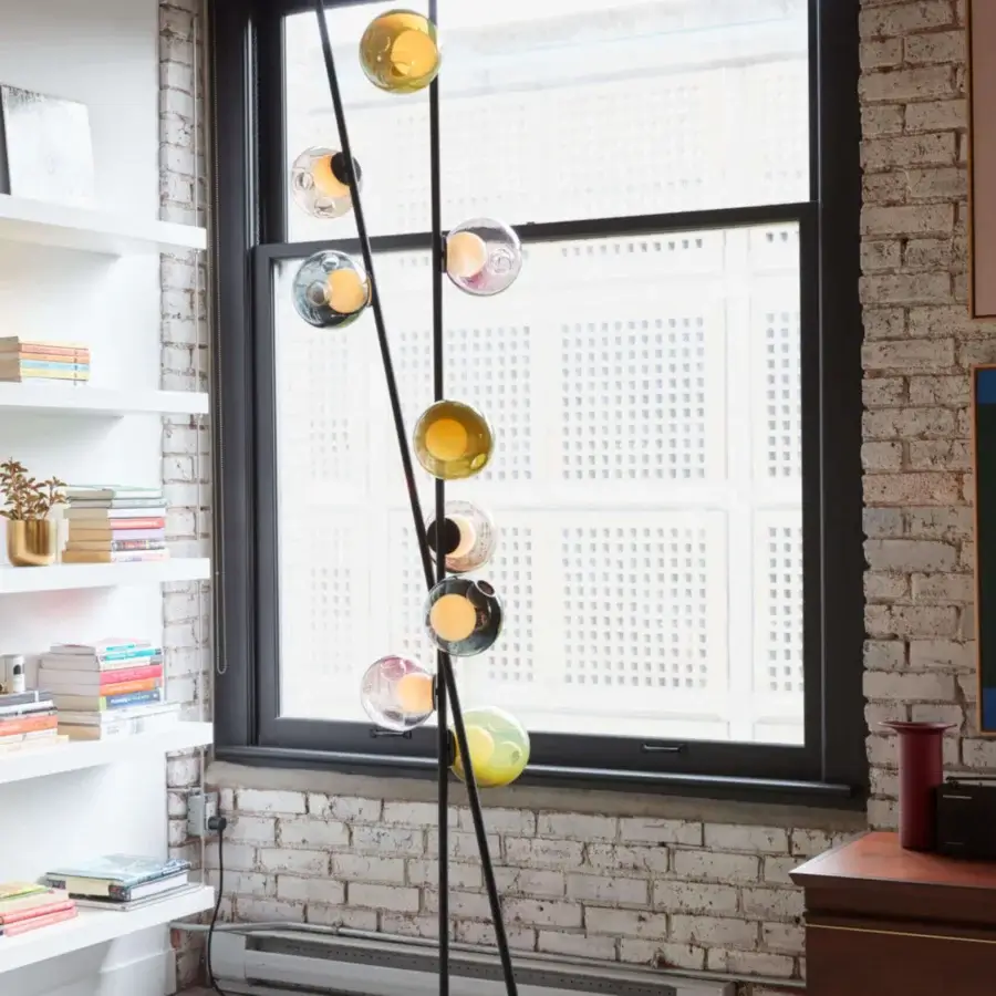 Sophisticated Bocci 28 Stem Floor to Ceiling Lamp with black metal, clear glass spheres, plus vibrant yellow, white, pink, and green shades