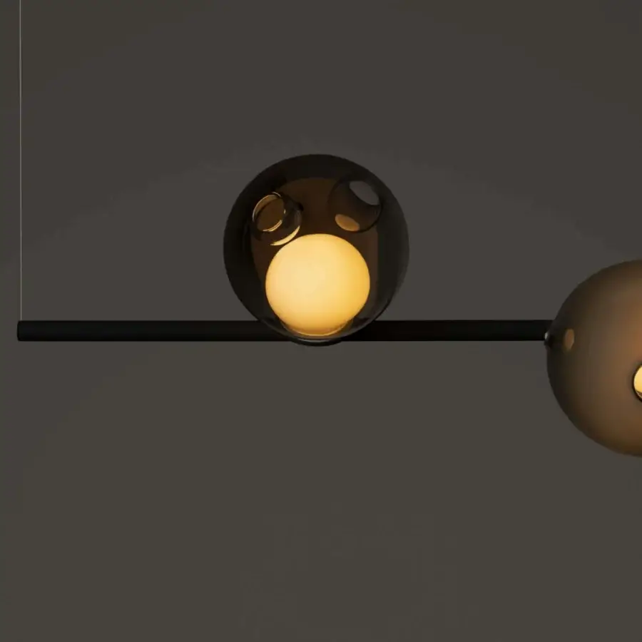 Distinguished Bocci 28 Stem suspension lamp with translucent amber glass spheres and a matte black unlacquered brass stem structure