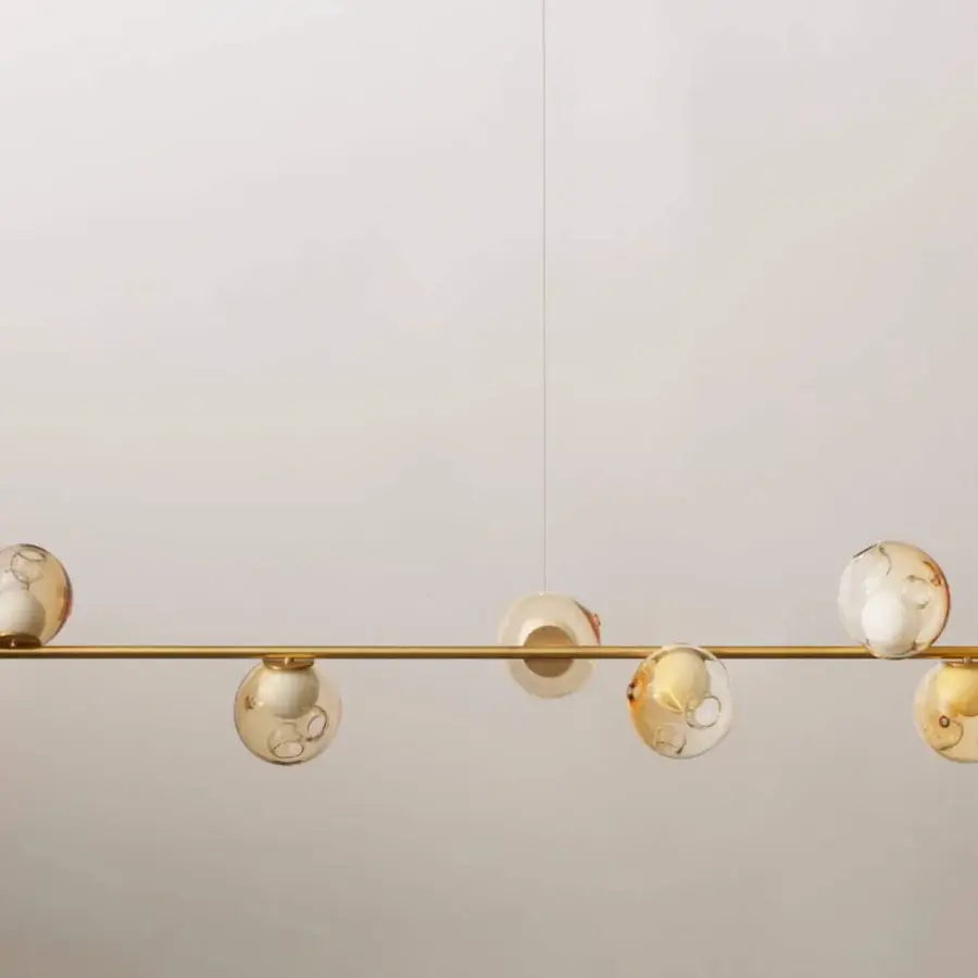 Superior Bocci 28 Stem suspension lamp with translucent warm amber hand-blown glass pendants and unlacquered brass structure
