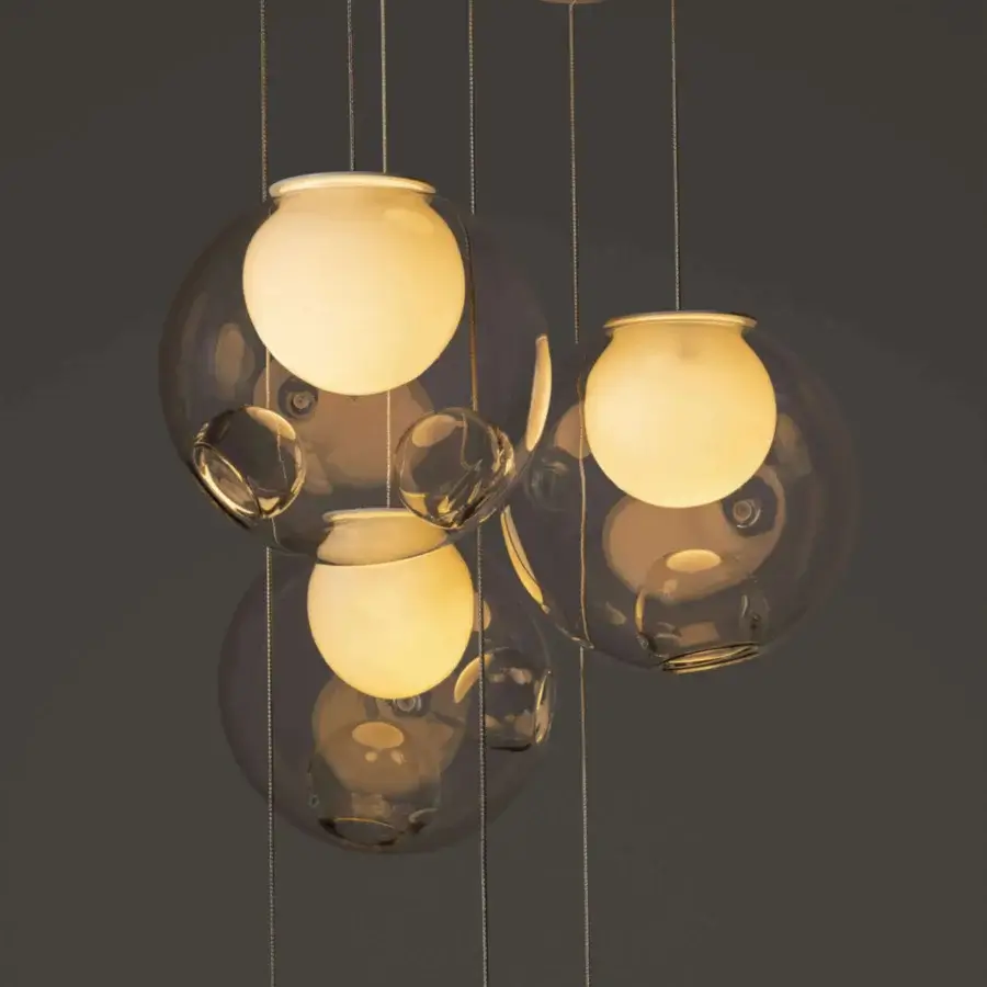 Captivating Bocci 28 Random suspension lamp with clear glass spheres and milk white interiors accented with warm amber tones