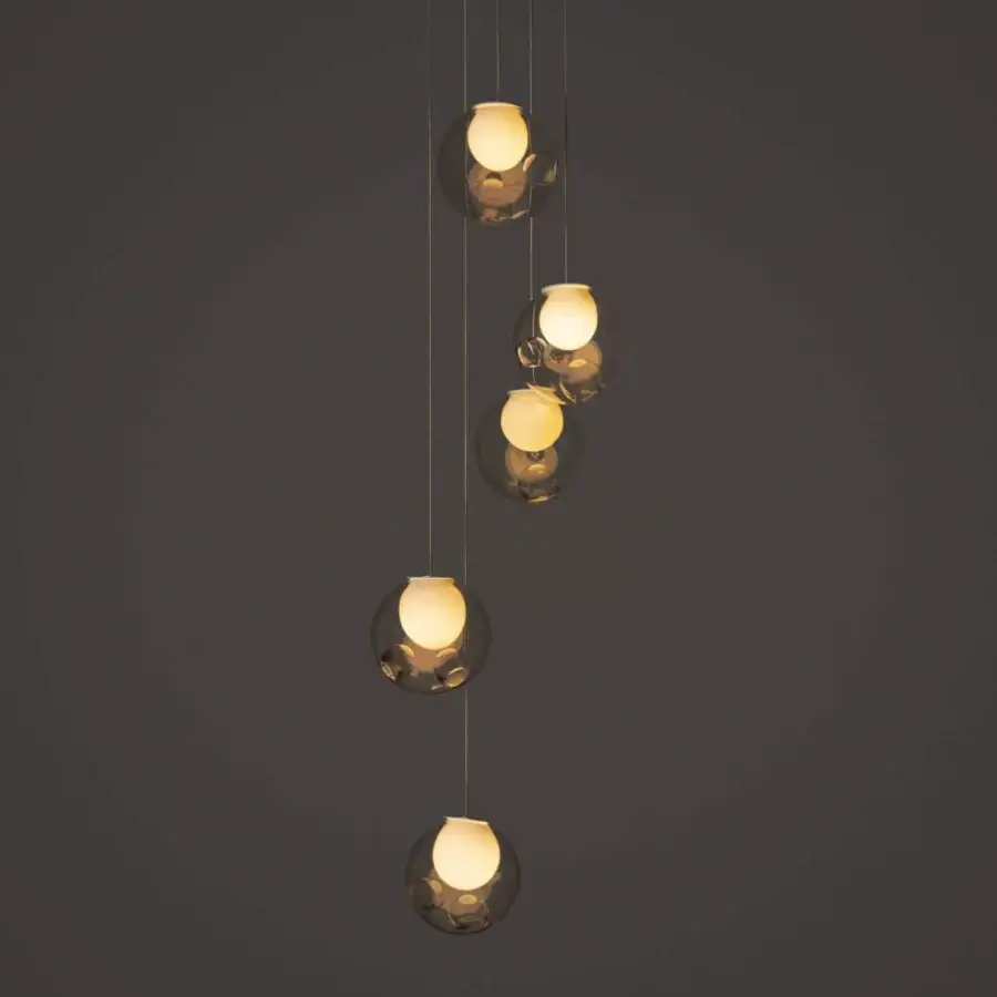Luxury Bocci 28 Random suspension lamp crafted with clear glass exhibiting a warm amber hue and milk white interior