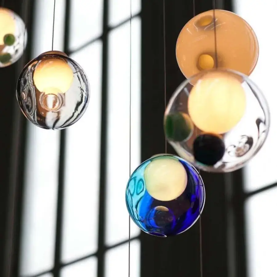 Exceptional Bocci 28 Random suspension lamp crafted in clear glass with milk white interiors and suspended blue green orbs