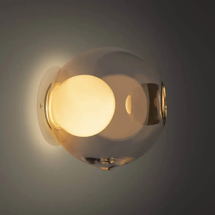 Elegant Bocci 28s lamp crafted in clear glass with a polished silver-grey metal base for atmospheric groupings