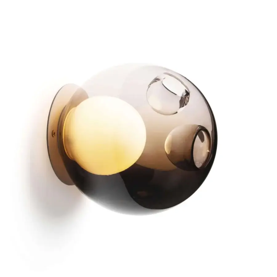 Exceptional Bocci 28s lamp with dark tinted translucent glass and bright milk white interior secured by a brushed gold-tone baseplate
