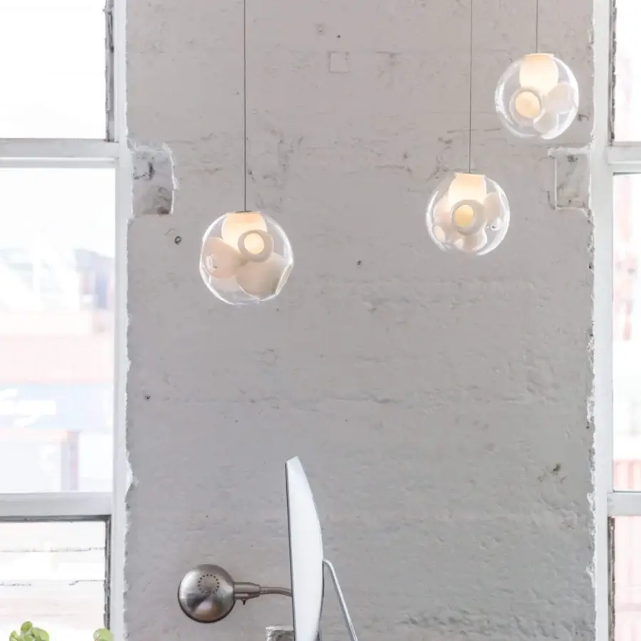 Exceptional Bocci 38V Single Suspension Lamp lighting fixture crafted in clear glass with milk white interior and metal rods