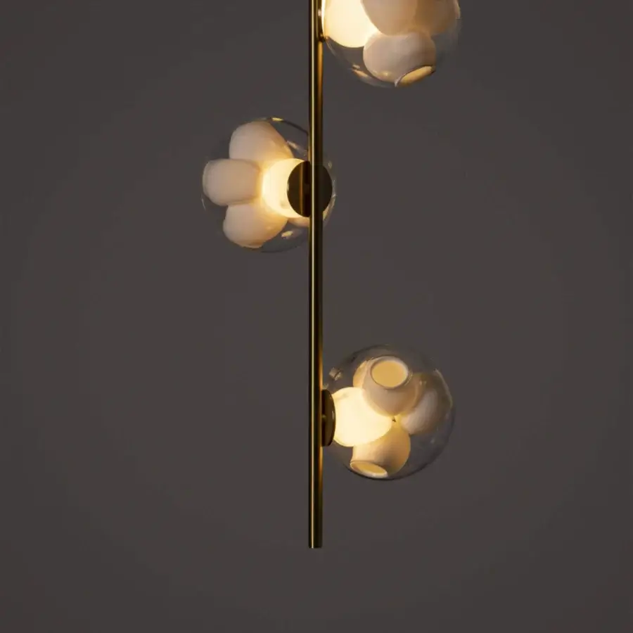 Distinguished Bocci 38V Stem ceiling lamp with a tall brass stem and clear glass spheres encasing sculpted off-white interiors