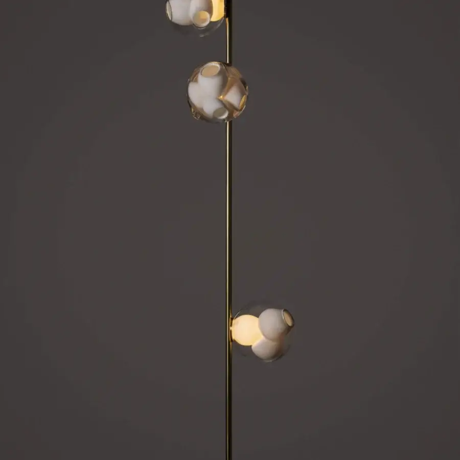 Exclusive Bocci 38V Stem lamp with descending clear glass shades and a brass finish creating diffused light