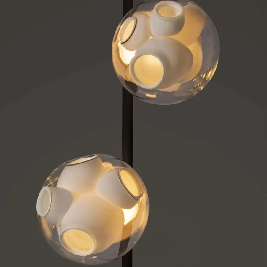 Distinguished Bocci 38V Stem floor lamp with clear glass exterior and milk white interior crafted in a brass finish