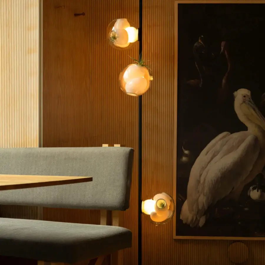 Distinguished Bocci 38V Stem floor lamp with clear glass exterior and milk white interior, crafted in black metal with a matte finish