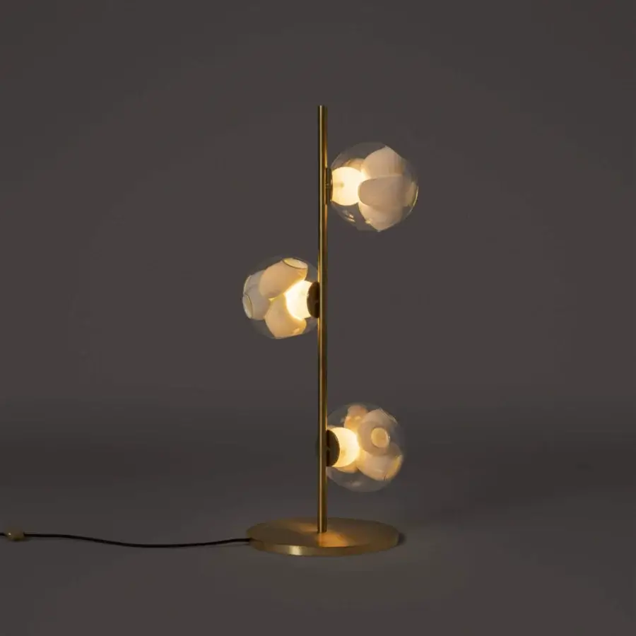 Captivating Bocci 38V Stem floor lamp with brass finish and clear glass exterior paired with milk white interior cavities