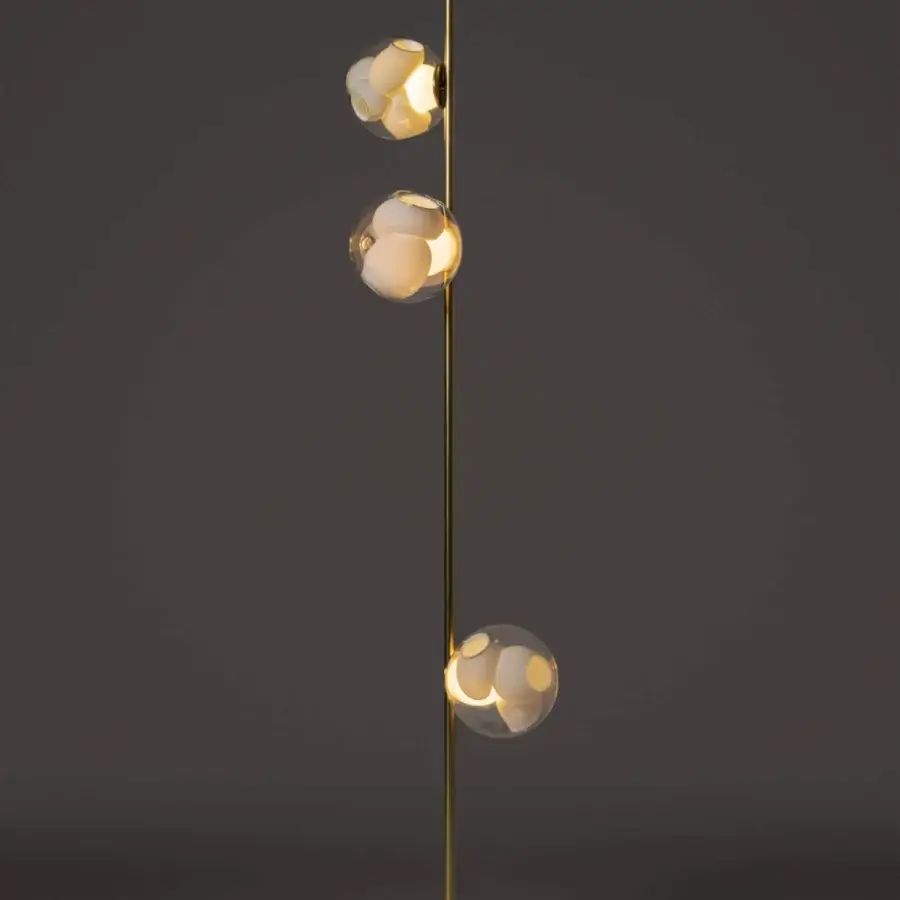 Superior Bocci 38V Stem floor lamp with warm gold finish, clear glass exterior and unique interior cavities
