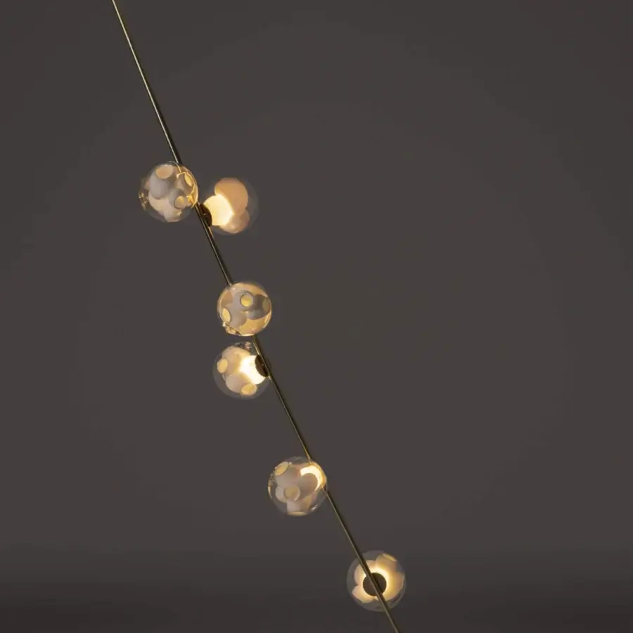 Elegant Bocci 38V Stem floor lamp with diagonally oriented metal and clear glass exterior spheres in milk white