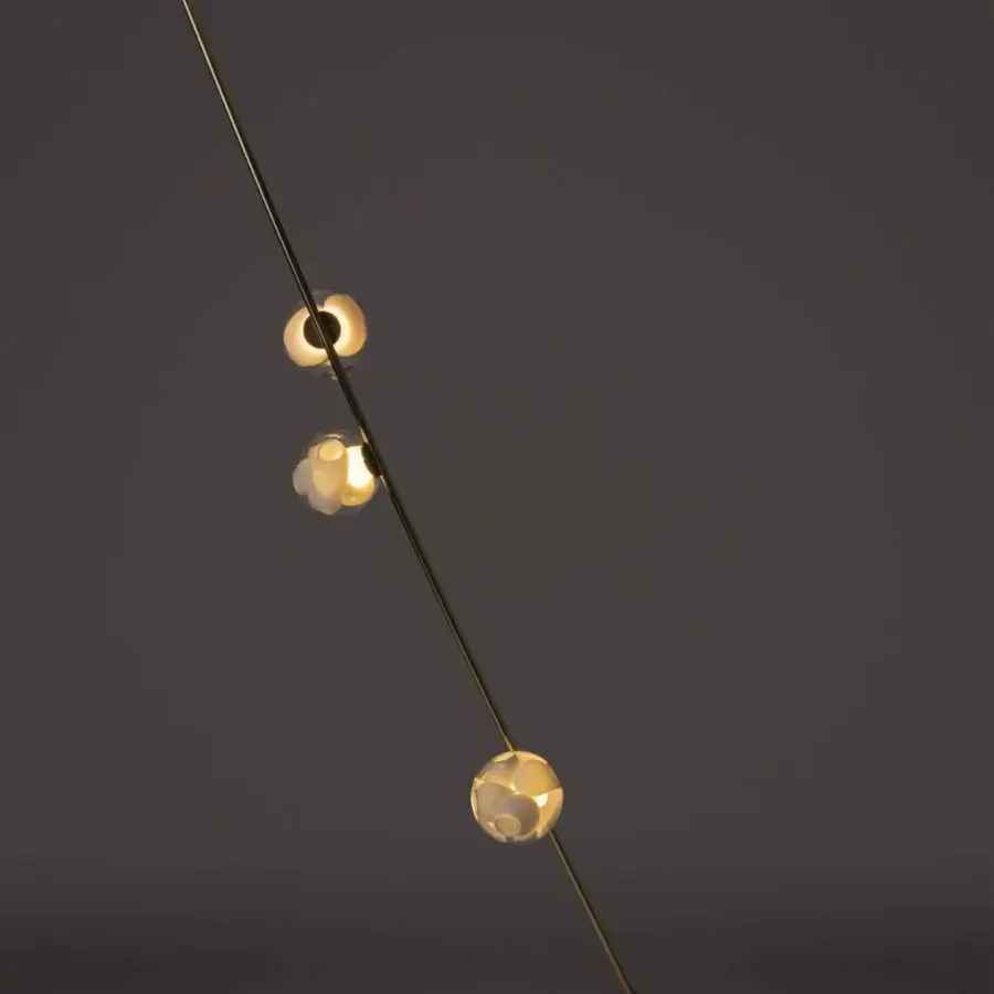 Superior Bocci 38V Stem floor lamp crafted with brass finish and clear glass shades exhibiting a satin texture