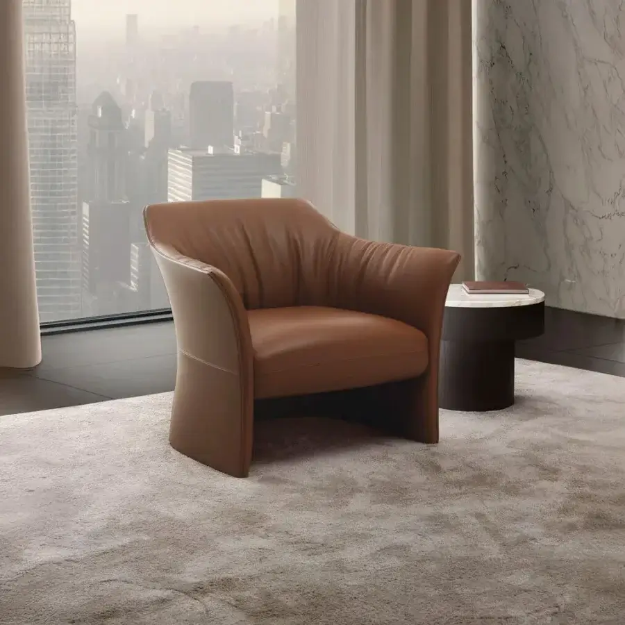 Distinguished 4 Mariani Sella lounge chair with warm brown leather upholstery and smooth matte finish